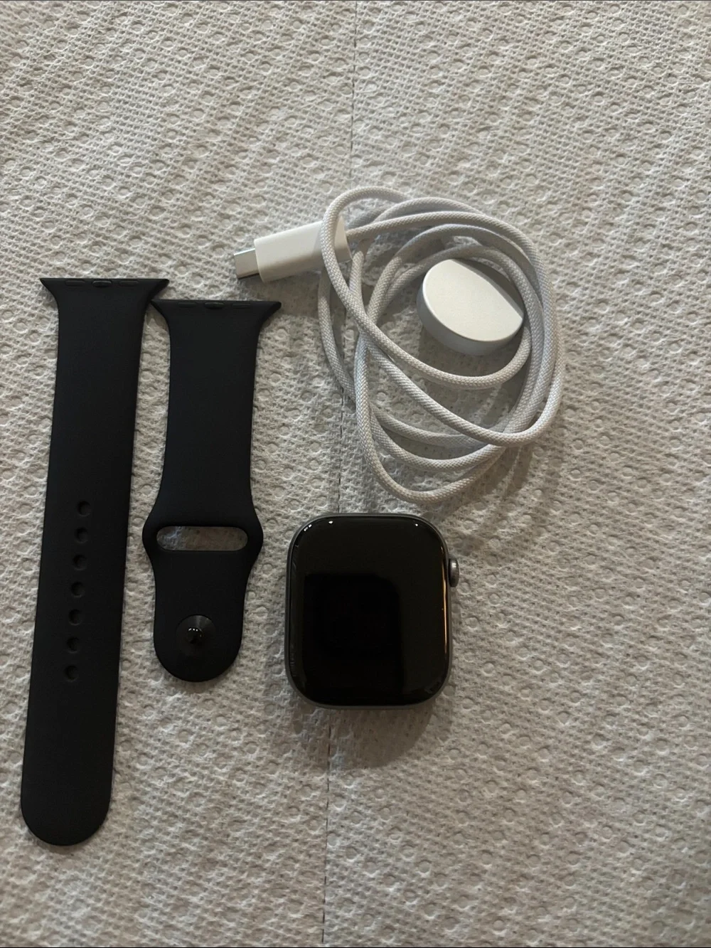 Apple Black and grey Smartwatch with Black Sport Band and White Charger Cable